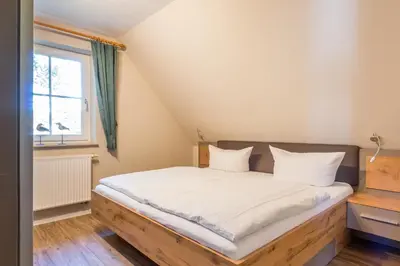 Ein Bett oder Betten in einem Zimmer der Unterkunft Jagdhaus Schwinkelsmoor