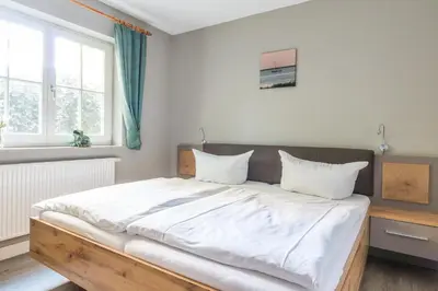 Ein Bett oder Betten in einem Zimmer der Unterkunft Jagdhaus Schwinkelsmoor