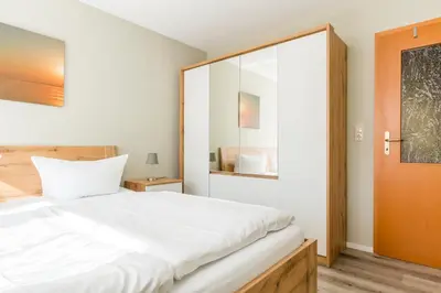 Ein Bett oder Betten in einem Zimmer der Unterkunft Jagdhaus Prerowstrom