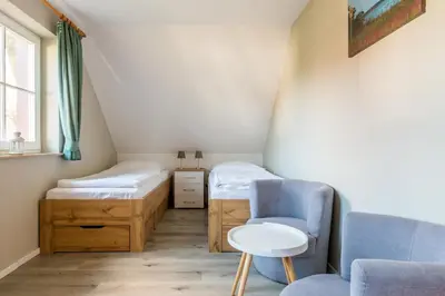 Ein Bett oder Betten in einem Zimmer der Unterkunft Jagdhaus Prerowstrom