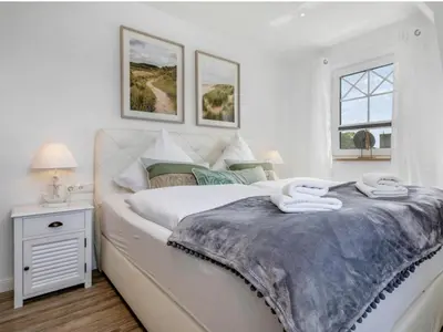 Ein Bett oder Betten in einem Zimmer der Unterkunft House Küstenkind