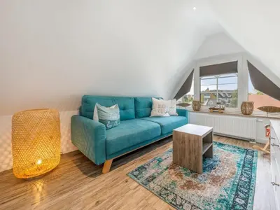 Ein Sitzbereich in der Unterkunft House Küstenkind