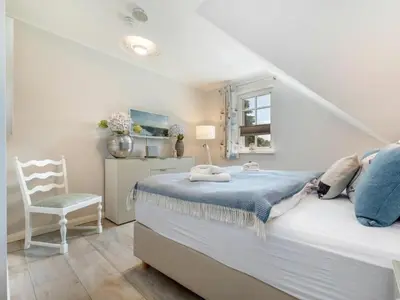 Ein Bett oder Betten in einem Zimmer der Unterkunft Holiday home in Zingst with swimming pool