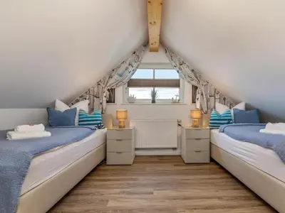 Ein Bett oder Betten in einem Zimmer der Unterkunft Holiday home in Zingst with swimming pool