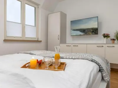Ein Bett oder Betten in einem Zimmer der Unterkunft Erika-Maria 02 OG