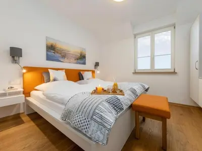 Ein Bett oder Betten in einem Zimmer der Unterkunft Erika-Maria 02 OG