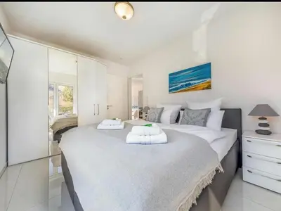 Ein Bett oder Betten in einem Zimmer der Unterkunft Suite Windsailer