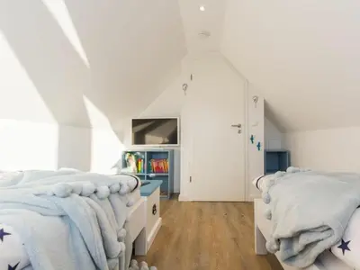 Ein Bett oder Betten in einem Zimmer der Unterkunft Holiday home in Zingst with swimming pool