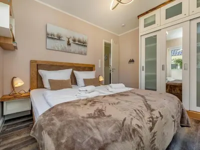 Ein Bett oder Betten in einem Zimmer der Unterkunft Suite Windböe - Holiday Resort Strandwiese