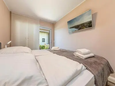 Ein Bett oder Betten in einem Zimmer der Unterkunft Suite Windböe - Holiday Resort Strandwiese