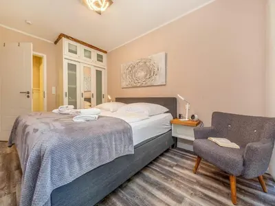 Ein Bett oder Betten in einem Zimmer der Unterkunft Suite Windböe - Holiday Resort Strandwiese