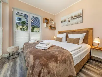 Ein Bett oder Betten in einem Zimmer der Unterkunft Suite Windböe - Holiday Resort Strandwiese