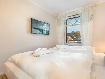 Ein Bett oder Betten in einem Zimmer der Unterkunft Suite 6 Windkieker