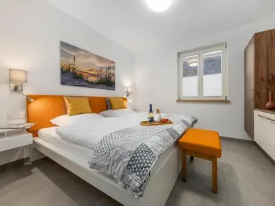 Ein Bett oder Betten in einem Zimmer der Unterkunft Erika-Maria 01 EG