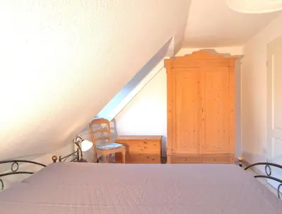 Ein Bett oder Betten in einem Zimmer der Unterkunft Birkmaase 16 - Komfort FeWo im 4-Sterne-Ferienhaus Manuela DG