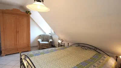 Ein Bett oder Betten in einem Zimmer der Unterkunft Birkmaase 18 - Komfort FeWo im 4-Sterne-Ferienhaus Yvonne DG