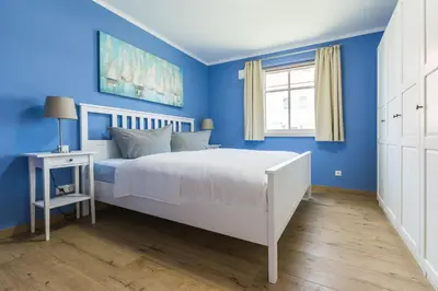 Ein Bett oder Betten in einem Zimmer der Unterkunft Haus Muschelsucher, Birkenstraße SIeben a, App 2