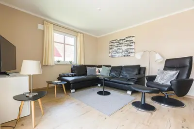 Ein Sitzbereich in der Unterkunft Haus Muschelsucher, Birkenstraße SIeben a, App 2