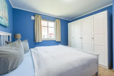 Ein Bett oder Betten in einem Zimmer der Unterkunft Haus Muschelsucher, Birkenstraße SIeben a, App 2