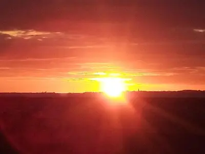 Blick auf den Sonnenuntergang/Sonnenaufgang von der Ferienwohnung aus oder aus der Nähe