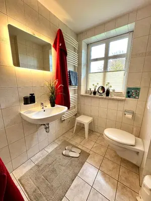 Ein Badezimmer in der Unterkunft BAUERNHAUS KRULL App 03