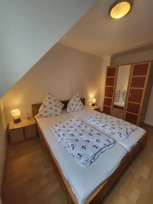 Ein Bett oder Betten in einem Zimmer der Unterkunft Ferienwohnung Böttcher