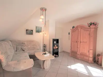 Ein Sitzbereich in der Unterkunft Birkmaase 14 - Komfort FeWo im 4-Sterne-Ferienhaus Anselm DG