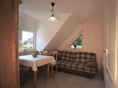 Ein Sitzbereich in der Unterkunft Birkmaase 14 - Komfort FeWo im 4-Sterne-Ferienhaus Anselm DG