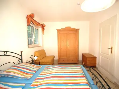 Ein Bett oder Betten in einem Zimmer der Unterkunft Birkmaase 16 - Komfort FeWo im 4-Sterne-Ferienhaus Manuela EG