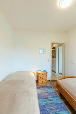 Ein Bett oder Betten in einem Zimmer der Unterkunft Haus Boddenperle Fewo Nr 4