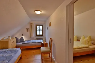 Ein Bett oder Betten in einem Zimmer der Unterkunft Haus unterm Reet rechts