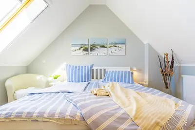 Ein Bett oder Betten in einem Zimmer der Unterkunft Ferienwohnung Nr 6