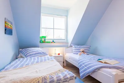 Ein Bett oder Betten in einem Zimmer der Unterkunft Ferienwohnung Nr 6