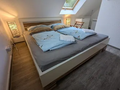 Ein Bett oder Betten in einem Zimmer der Unterkunft Am Deich 48 - Haus Sonne