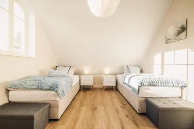 Ein Bett oder Betten in einem Zimmer der Unterkunft Strandwächter