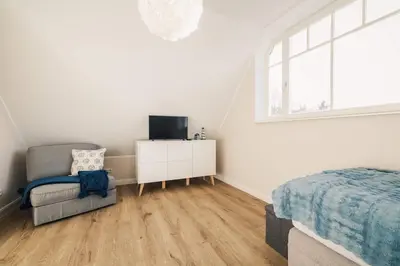 Ein Bett oder Betten in einem Zimmer der Unterkunft Strandwächter