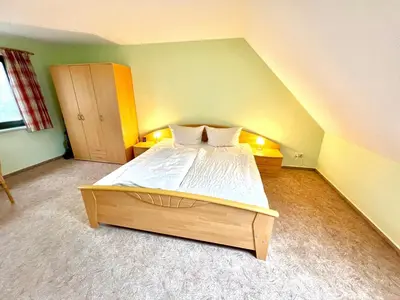 Ein Bett oder Betten in einem Zimmer der Unterkunft Lotsenkoje