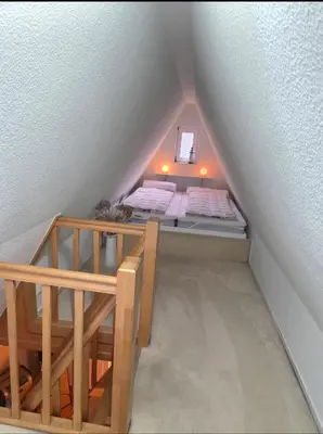 Ein Bett oder Betten in einem Zimmer der Unterkunft Atelierwohnung eines Fischers