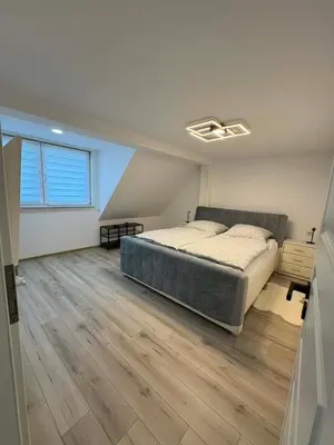 Ein Bett oder Betten in einem Zimmer der Unterkunft Apartament Bors