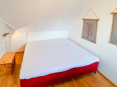 Ein Bett oder Betten in einem Zimmer der Unterkunft Haus Kormoran, Fewo Held