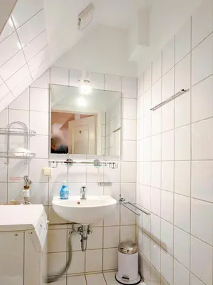 Ein Badezimmer in der Unterkunft Haus Kormoran, Fewo Held
