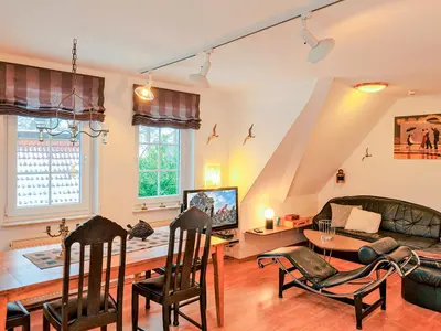 Ein Sitzbereich in der Unterkunft Haus Kormoran, Fewo Held