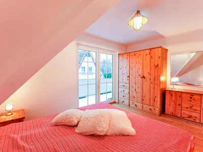 Ein Bett oder Betten in einem Zimmer der Unterkunft Haus Kormoran, Fewo Held