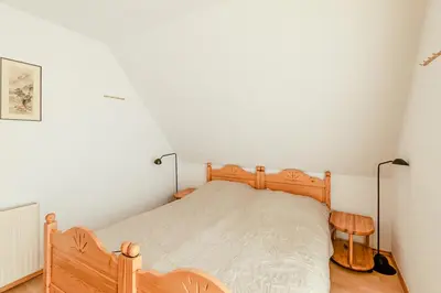 Ein Bett oder Betten in einem Zimmer der Unterkunft Haus Kormoran, Fewo Nr 8