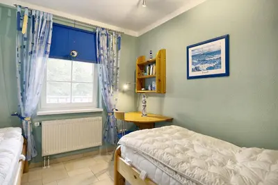 Ein Bett oder Betten in einem Zimmer der Unterkunft Strandstrasse 55 Wohnung Mücke