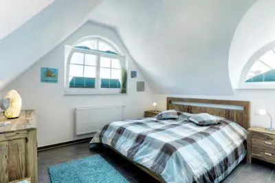 Ein Bett oder Betten in einem Zimmer der Unterkunft de Obendtied - Wohnung 6 