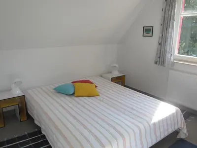 Ein Bett oder Betten in einem Zimmer der Unterkunft Möwennest