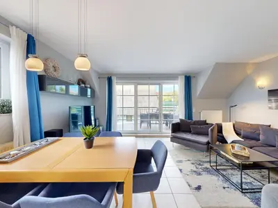 Ein Sitzbereich in der Unterkunft Ferienwohnung Blau & Sand