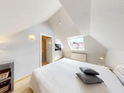 Ein Bett oder Betten in einem Zimmer der Unterkunft Ferienwohnung Blau & Sand