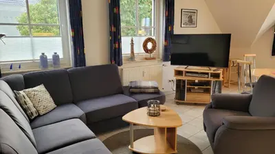 Ein Sitzbereich in der Unterkunft Ferienwohnung Hustadt